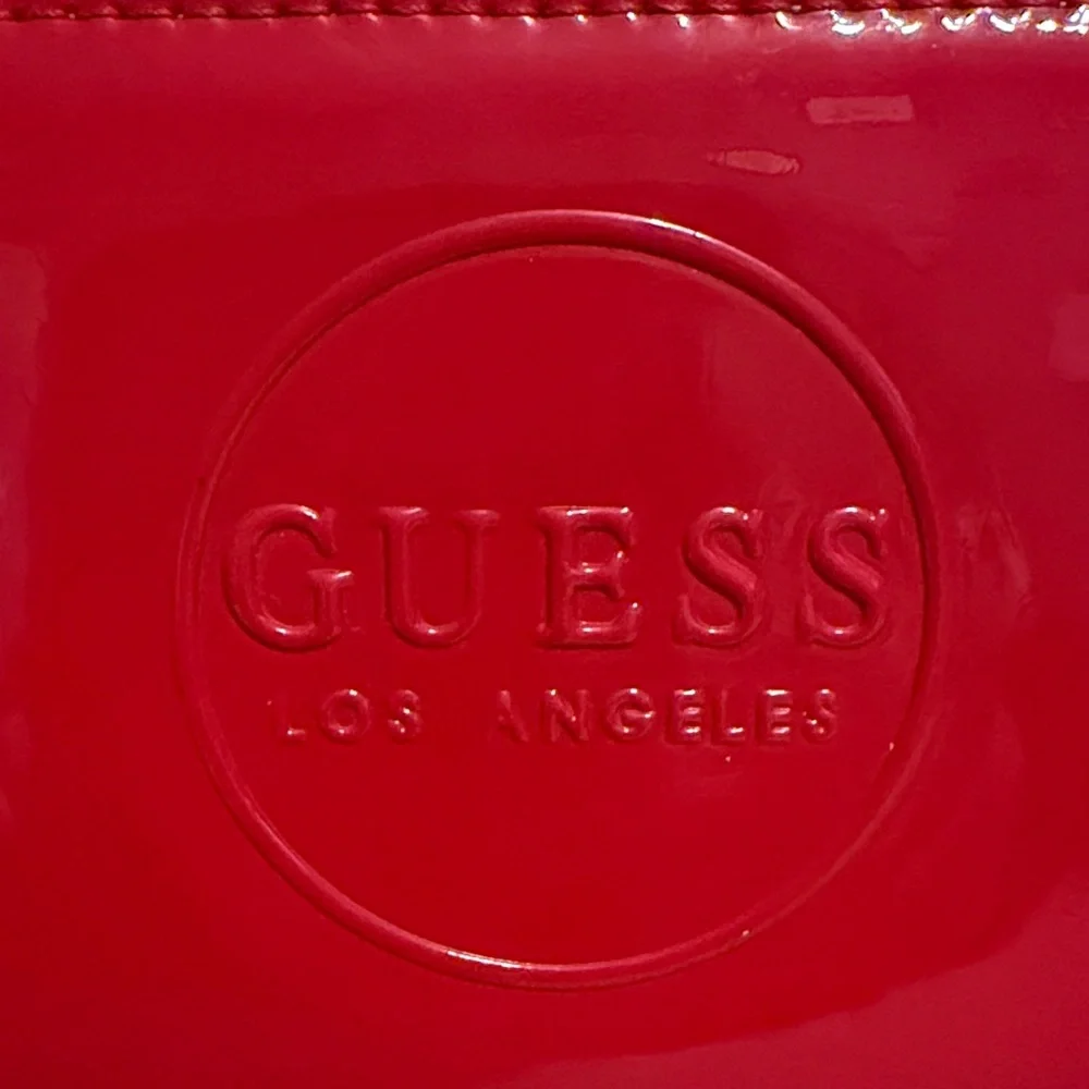 Guess features embossed